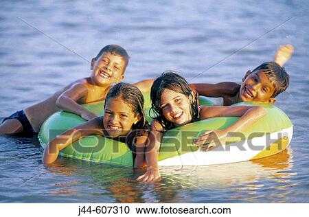 Children on a rubber ring View Large Photo Image Stock Image - Children on a rubber ring. Fotosearch