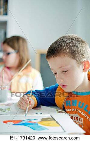 Stock Image - Children painting watercolor, Valencia, Spain. Fotosearch