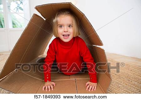 Children playing in a cardboard box View Large Photo Image Stock Image - Children playing in a cardboard box. Fotosearch
