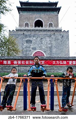 Children playing in a park near the Bell Tower, Beijing, China, Asia. View Large Photo Image Stock Image - Children playing in a park near the Bell Tower, Beijing, China, Asia.. Fotosearch