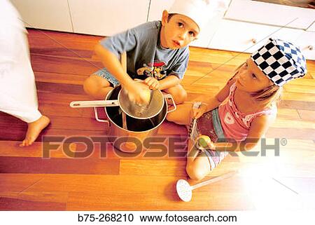 Children playing in the kitchen View Large Photo Image Stock Image - Children playing in the kitchen. Fotosearch