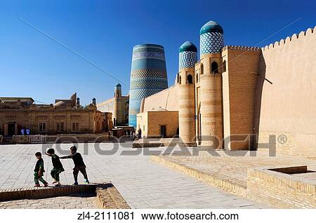 Children playing near the Kuhna Ark fortress and the unfinished minaret Kalta Minor. Uzbekistan, Khorezm, Khiva, Itchan Kala (inner town). View Large Photo Image Stock Image - Children playing near the Kuhna Ark fortress and the unfinished minaret Kalta Minor. Uzbekistan, Khorezm, Khiva, Itchan Kala (inner town).. Fotosearch