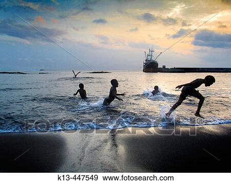 Children playing on beach by the port of Ipikel. Tanna, Vanuatu View Large Photo Image Stock Photo - Children playing on beach by the port of Ipikel. Tanna, Vanuatu. Fotosearch