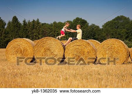 Children Playing on Corn Bales, Estonia View Large Photo Image Stock Photography - Children Playing on Corn Bales, Estonia. Fotosearch