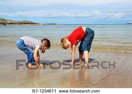 children playing on sandy beach, Sutherland, Scotland View Large Photo Image Stock Image - children playing on sandy beach, Sutherland, Scotland. Fotosearch