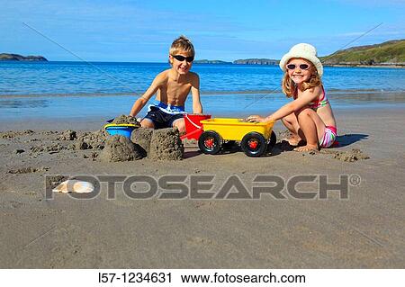 children playing on sandy beach, Sutherland, Scotland View Large Photo Image Stock Image - children playing on sandy beach, Sutherland, Scotland. Fotosearch