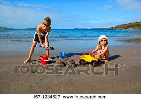 children playing on sandy beach, Sutherland, Scotland View Large Photo Image Stock Photo - children playing on sandy beach, Sutherland, Scotland. Fotosearch