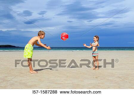 children playing on sandy beach, Sutherland, Scotland View Large Photo Image Stock Photo - children playing on sandy beach, Sutherland, Scotland. Fotosearch