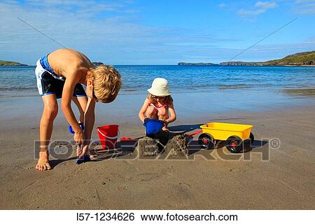 children playing on sandy beach, Sutherland, Scotland View Large Photo Image Stock Photograph - children playing on sandy beach, Sutherland, Scotland. Fotosearch