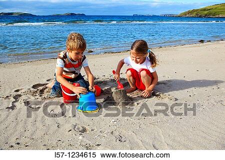 children playing on sandy beach, Sutherland, Scotland View Large Photo Image Stock Photography - children playing on sandy beach, Sutherland, Scotland. Fotosearch