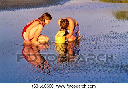Children playing on the beach View Large Photo Image Stock Image - Children playing on the beach. Fotosearch