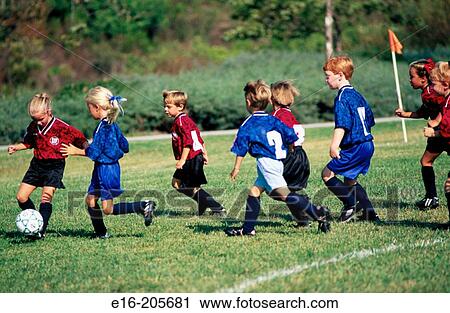 Stock Image - Children playing soccer. Fotosearch