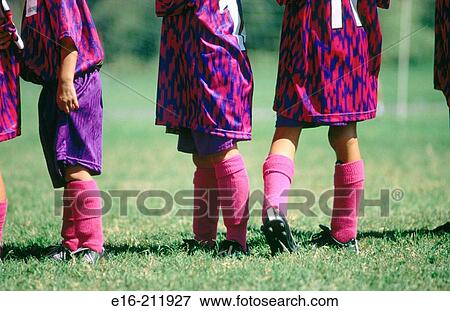 Stock Photo - Children playing soccer. Fotosearch