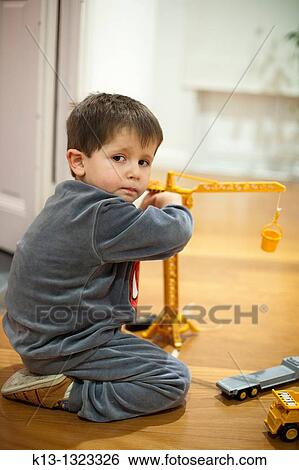 Children playing with a crane View Large Photo Image Stock Photograph - Children playing with a crane. Fotosearch