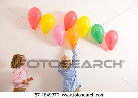Children playing with balloons View Large Photo Image Stock Image - Children playing with balloons. Fotosearch