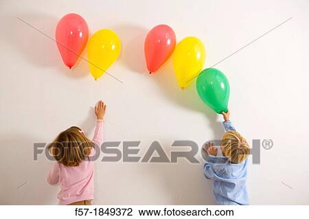 Children playing with balloons View Large Photo Image Stock Image - Children playing with balloons. Fotosearch