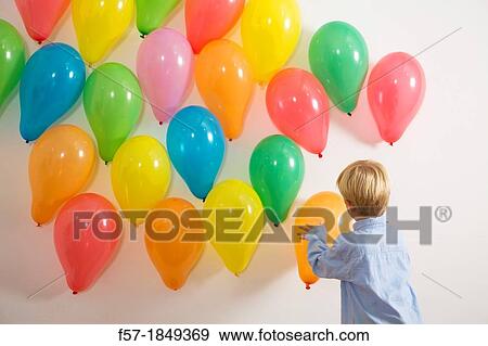 Children playing with balloons View Large Photo Image Stock Photo - Children playing with balloons. Fotosearch