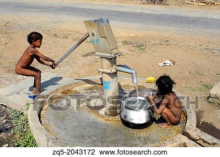 Children pumping water, Orissa, India. View Large Photo Image Stock Image - Children pumping water, Orissa, India.. Fotosearch