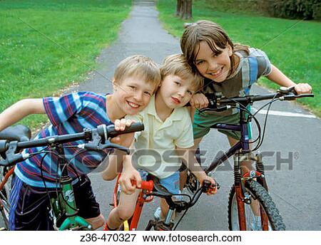 Children riding bicycles together View Large Photo Image Stock Photo - Children riding bicycles together. Fotosearch
