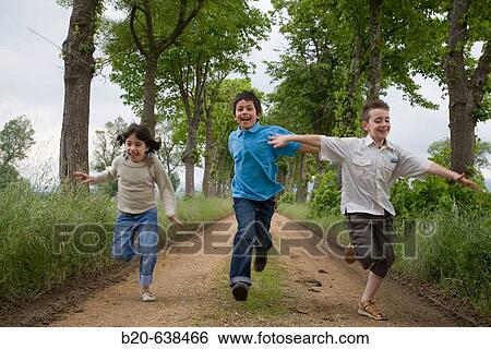 Children running by tree-lined path. Arkaute, Alava, Euskadi, Spain View Large Photo Image Stock Photograph - Children running by tree-lined path. Arkaute, Alava, Euskadi, Spain. Fotosearch