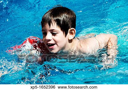 Children swimming in a pool View Large Photo Image Stock Photograph - Children swimming in a pool. Fotosearch