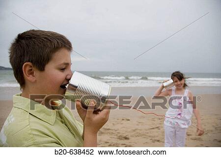 Children using cans to communicate View Large Photo Image Stock Image - Children using cans to communicate. Fotosearch