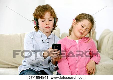 Stock Image - Children using smartphone. Fotosearch