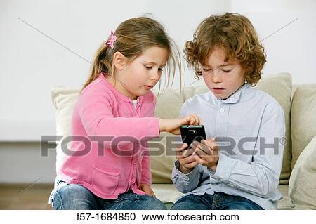 Children using smartphone View Large Photo Image Stock Image - Children using smartphone. Fotosearch