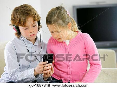 Children using smartphone View Large Photo Image Stock Photo - Children using smartphone. Fotosearch