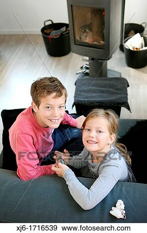 Stock Photo - Children using smartphone. Fotosearch
