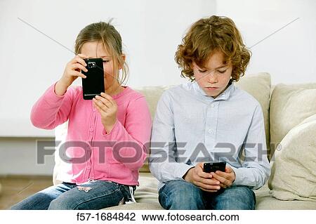 Children using smartphones View Large Photo Image Stock Image - Children using smartphones. Fotosearch