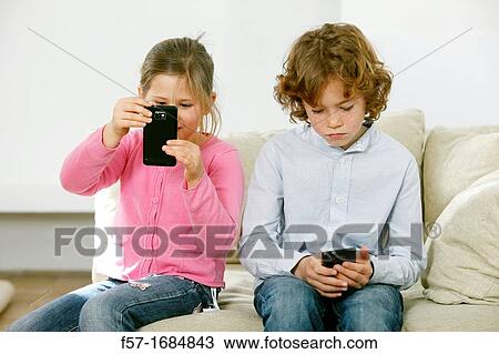 Children using smartphones View Large Photo Image Stock Image - Children using smartphones. Fotosearch