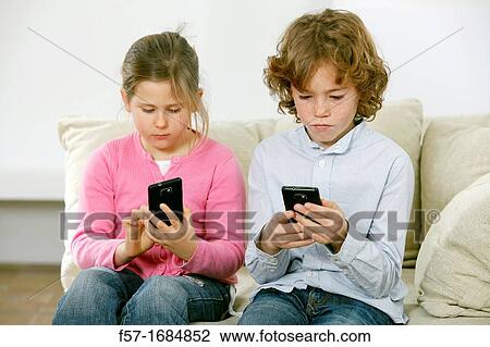 Children using smartphones View Large Photo Image Stock Image - Children using smartphones. Fotosearch