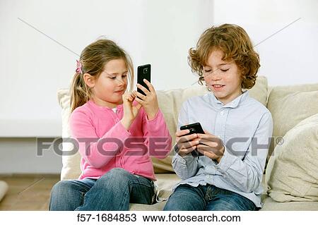 Children using smartphones View Large Photo Image Stock Image - Children using smartphones. Fotosearch