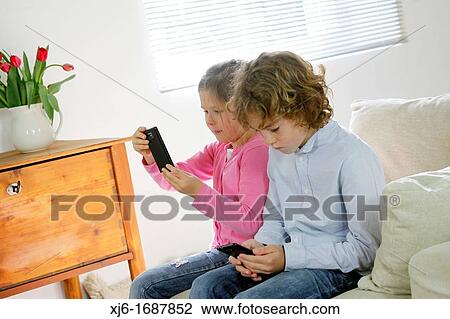 Children using smartphones View Large Photo Image Stock Image - Children using smartphones. Fotosearch