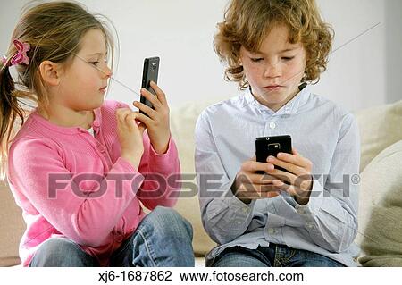Children using smartphones View Large Photo Image Stock Image - Children using smartphones. Fotosearch