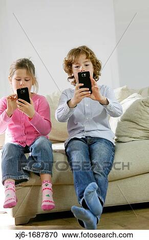 Children using smartphones View Large Photo Image Stock Image - Children using smartphones. Fotosearch