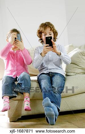 Children using smartphones View Large Photo Image Stock Image - Children using smartphones. Fotosearch