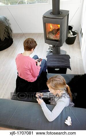 Stock Image - Children using smartphones. Fotosearch
