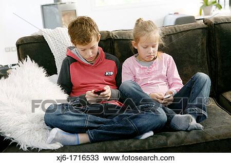 Children using smartphones View Large Photo Image Stock Image - Children using smartphones. Fotosearch