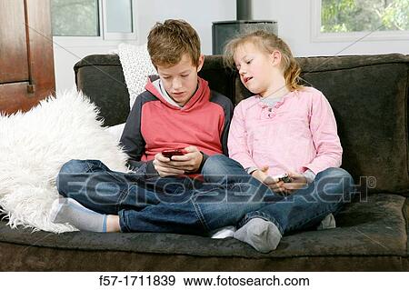Children using smartphones View Large Photo Image Stock Photo - Children using smartphones. Fotosearch