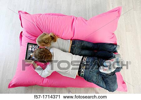 Children using tablet computer View Large Photo Image Stock Image - Children using tablet computer. Fotosearch