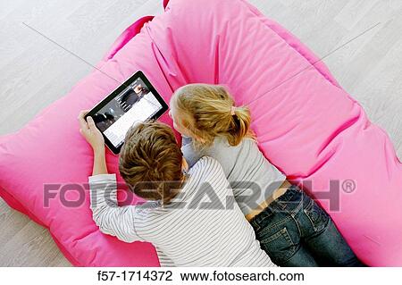 Children using tablet computer View Large Photo Image Stock Image - Children using tablet computer. Fotosearch