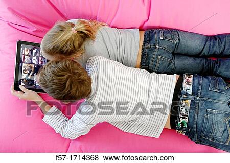 Children using tablet computer View Large Photo Image Stock Photo - Children using tablet computer. Fotosearch