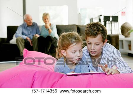 Children using tablet computer View Large Photo Image Stock Photograph - Children using tablet computer. Fotosearch