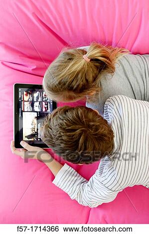 Children using tablet computer View Large Photo Image Stock Photograph - Children using tablet computer. Fotosearch