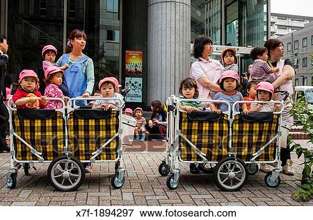children waiting for look the Sanno Matsuri parade, near the Ichigaya station The parade begins and ends at HieJinja shrine, Nagata-cho Tokyo city, Japan, Asia View Large Photo Image Stock Photo - children waiting for look the Sanno Matsuri parade, near the Ichigaya station The parade begins and ends at HieJinja shrine, Nagata-cho Tokyo city, Japan, Asia. Fotosearch