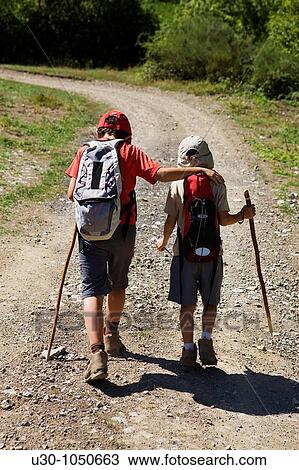 Children walking along a route in Li? bana valley Picos De Europa National Park Cantabria Spain View Large Photo Image Stock Image - Children walking along a route in Li? bana valley Picos De Europa National Park Cantabria Spain. Fotosearch