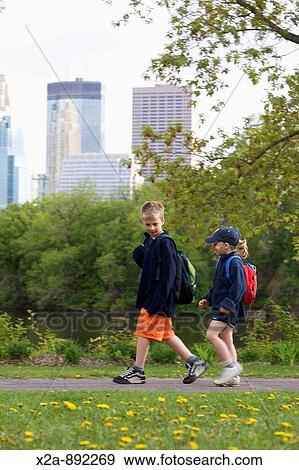 CHILDREN WALKING IN MINNEAPOLIS PARK View Large Photo Image Stock Photo - CHILDREN WALKING IN MINNEAPOLIS PARK. Fotosearch