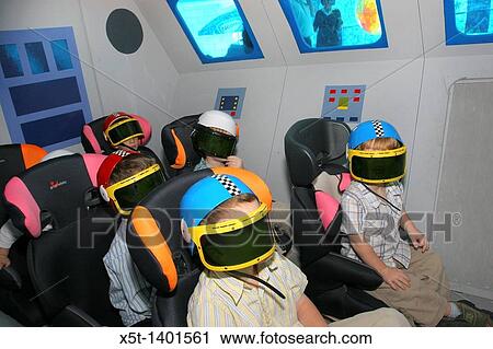 Children wearing VR helmets in a space shuttle simulator View Large Photo Image Stock Image - Children wearing VR helmets in a space shuttle simulator. Fotosearch